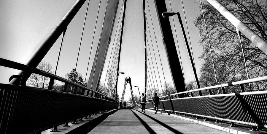 A black and white photo of the bridge at Alton Baker Park in Eugene, Oregon.