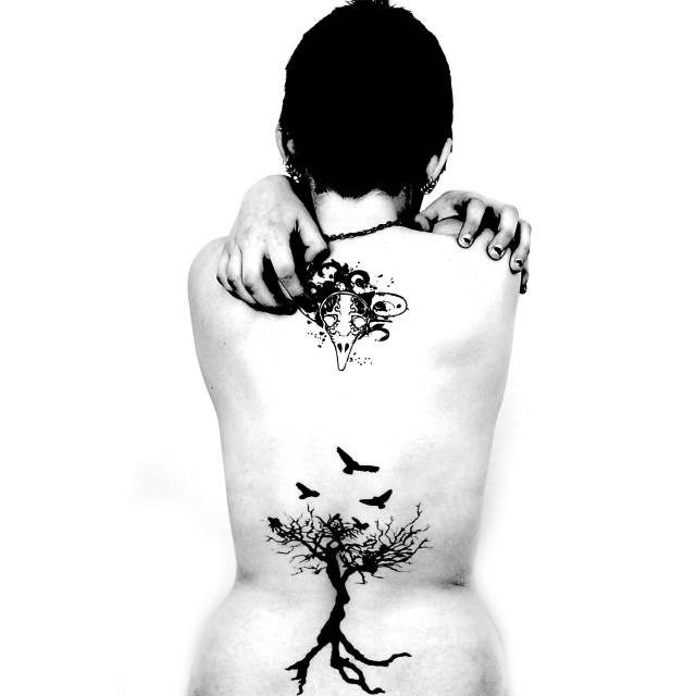 Black and white portrait photography of a tattooed woman